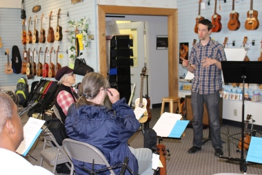 Milo Fultz teaching an 'ukulele bass workshop